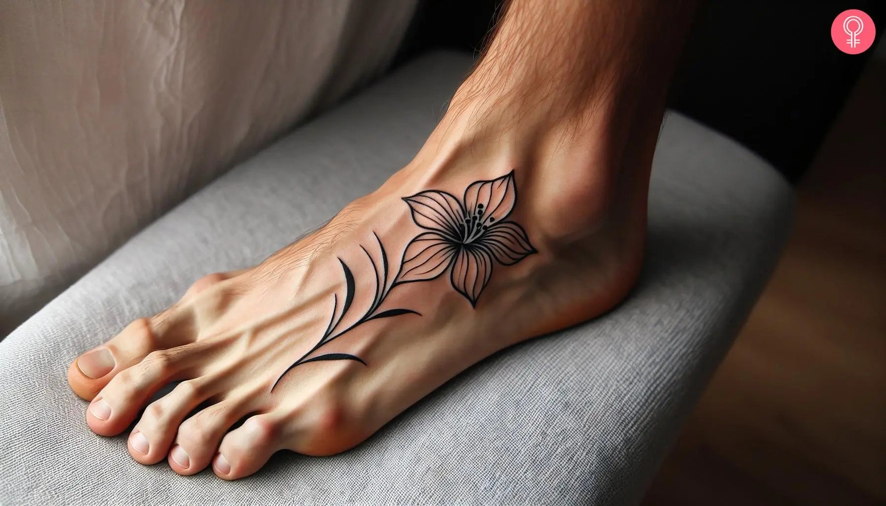 Tattoo of a small flower on the foot