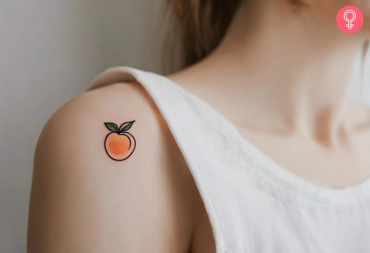 Tiny peach tattoo on the shoulder