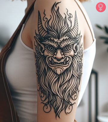A gremlin tattoo on the forearm