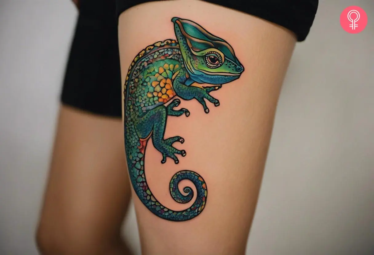 A traditional chameleon tattoo on a woman’s thigh