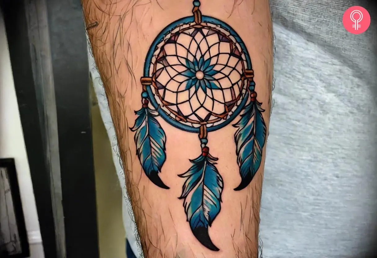 A traditional dreamcatcher tattoo on the forearm