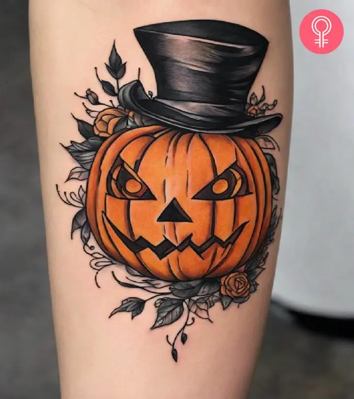 A jack-o'-lantern tattoo on the forearm