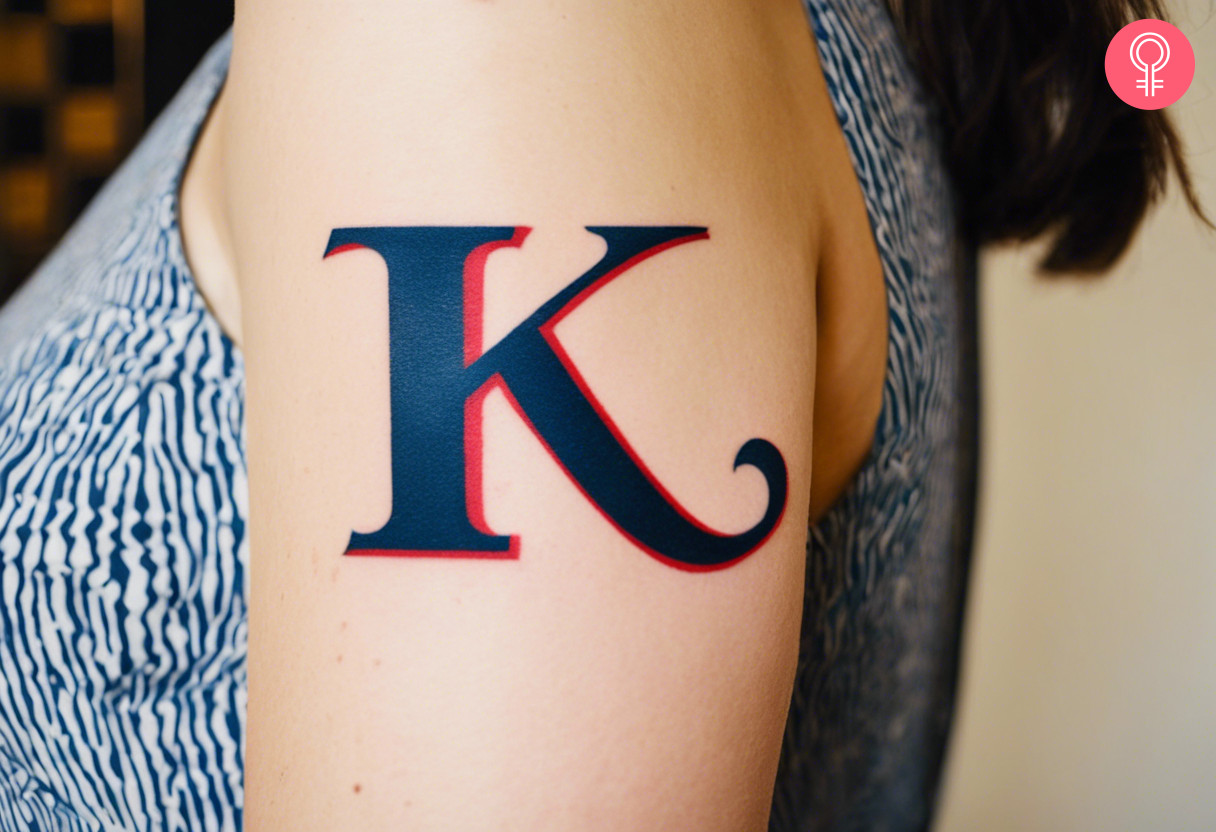 Traditional K-letter tattoo on a woman’s arm