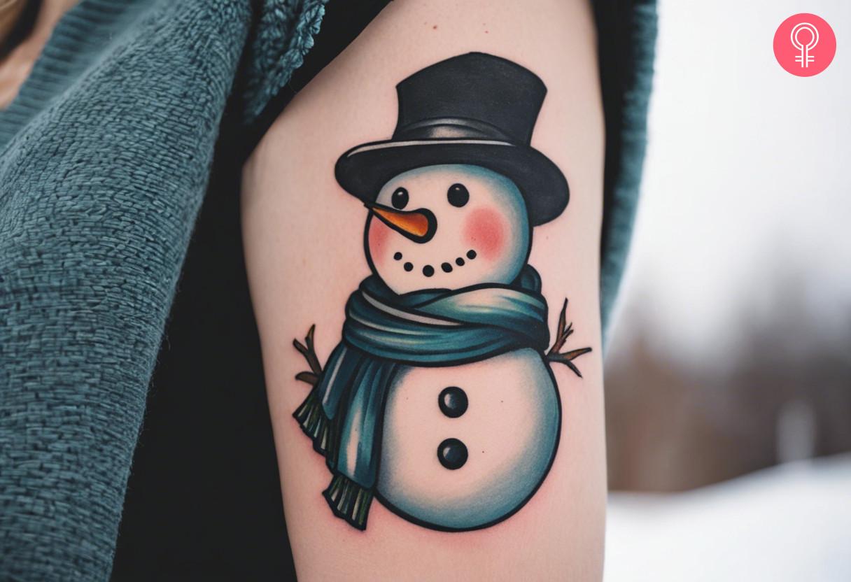 A woman with a traditional snowman tattoo on her upper arm