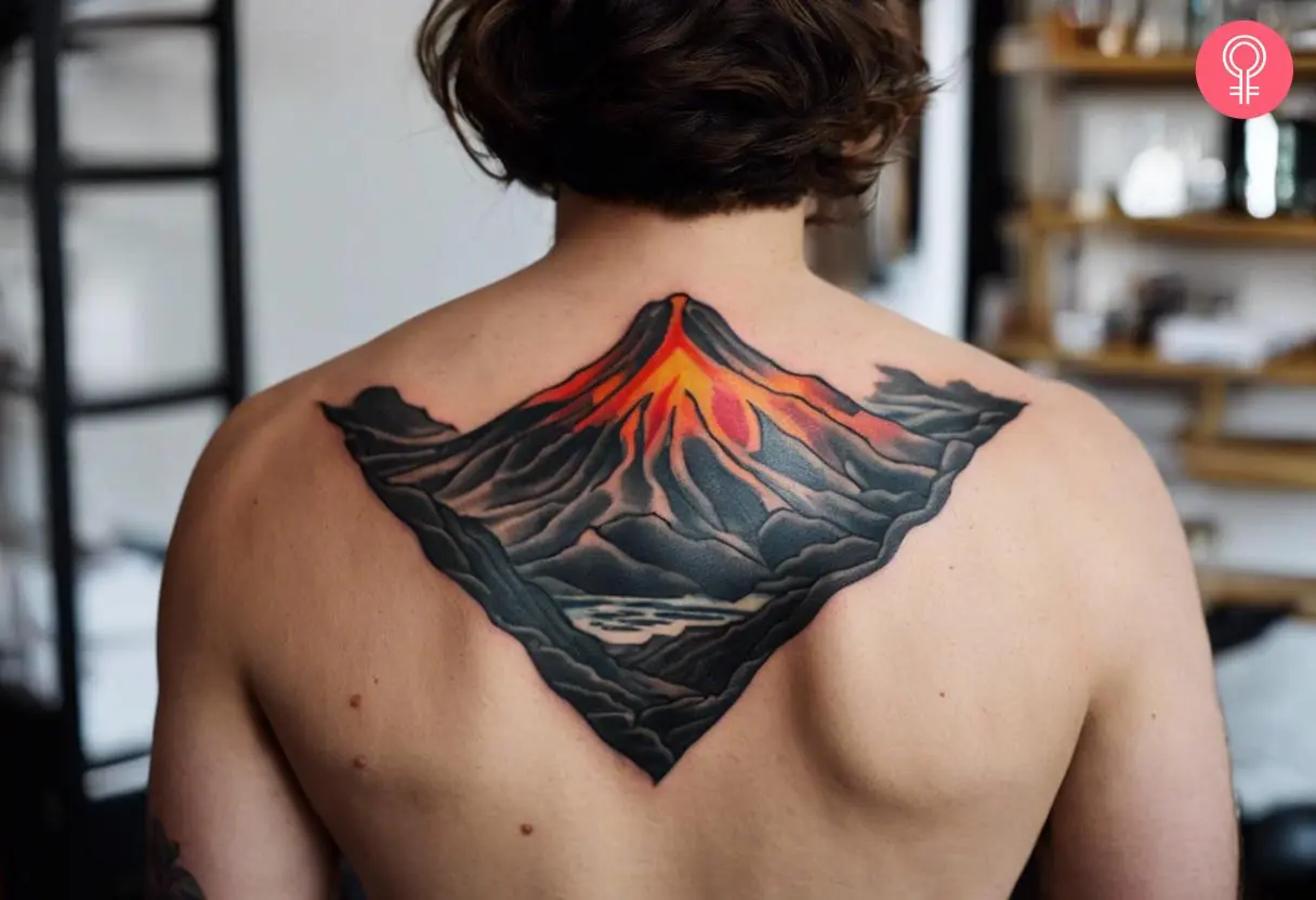 A man wearing a traditional volcano tattoo on the upper back