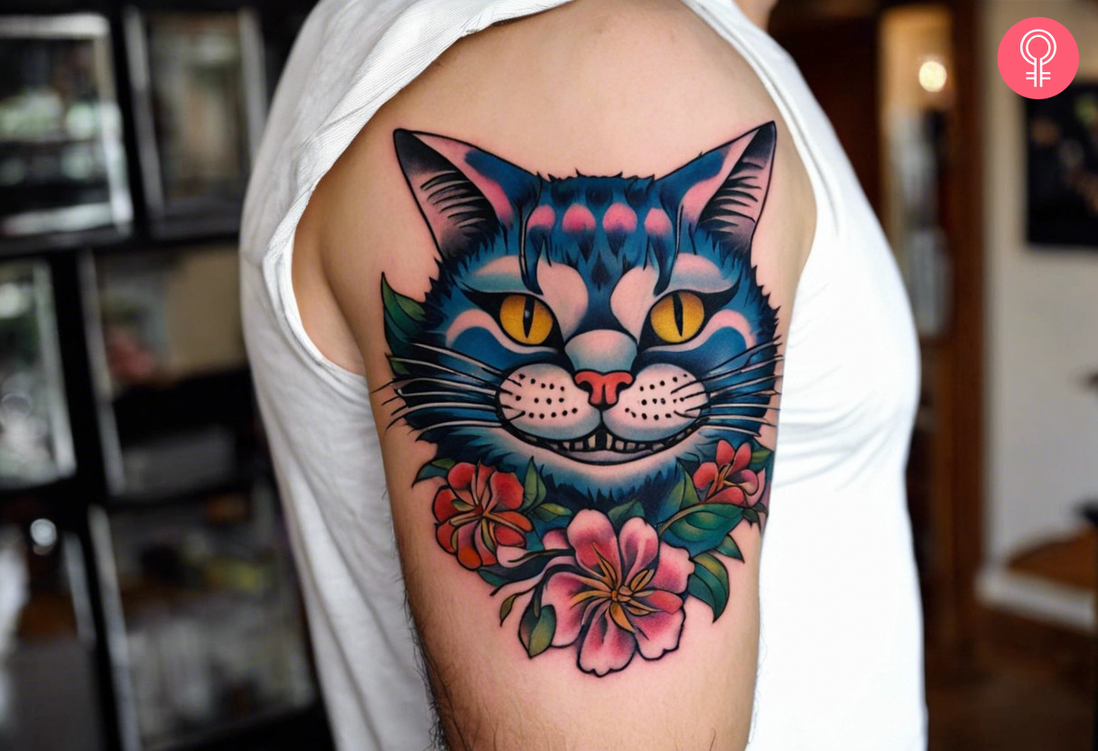 Traditional cheshire cat tattoo on the upper arm