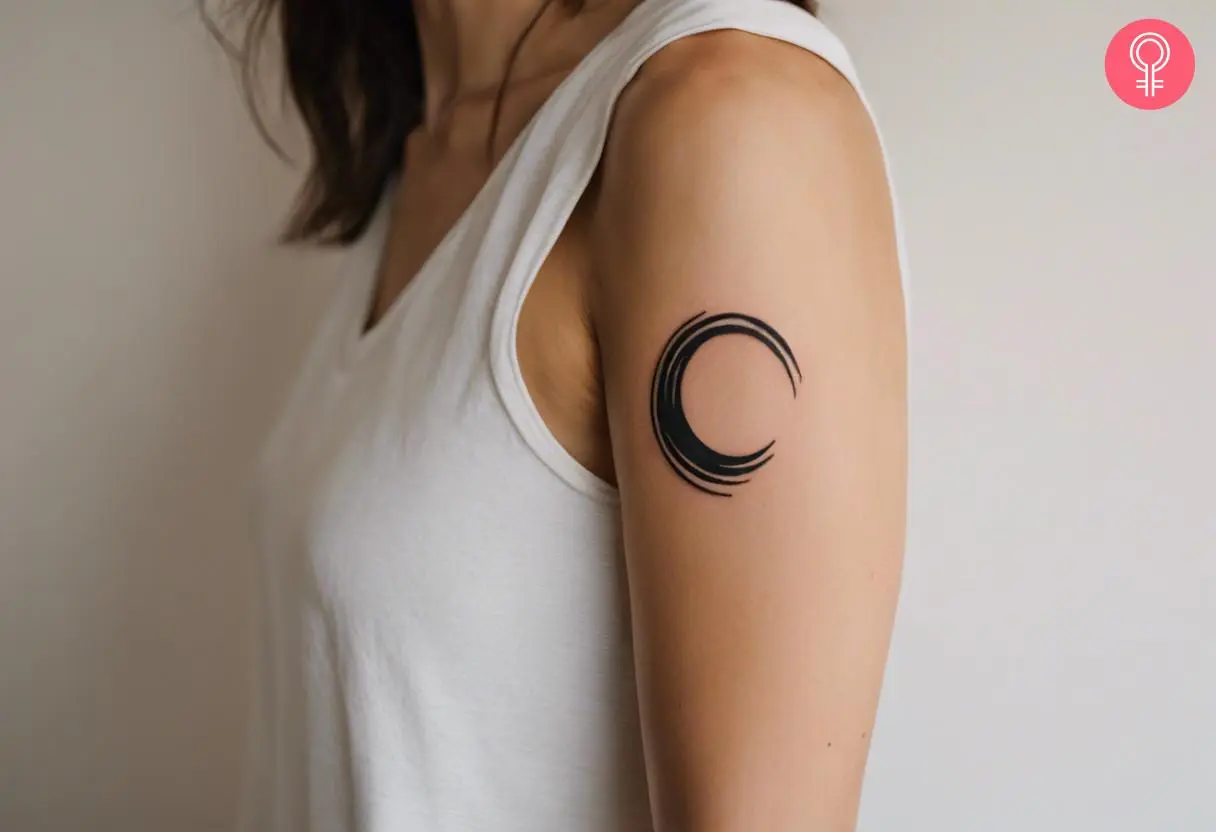 Traditional enso tattoo on a woman’s upper arm