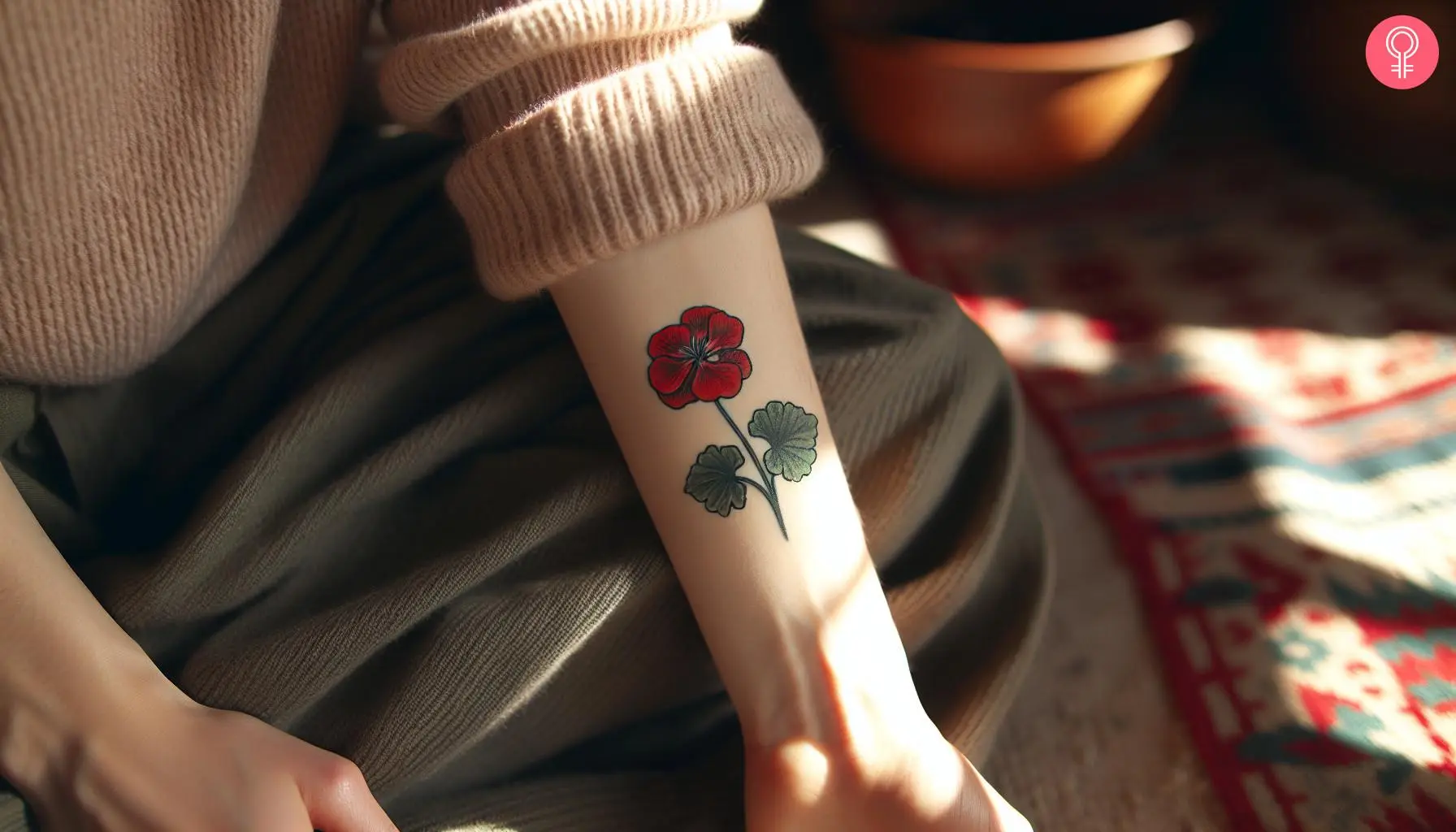 Traditional geranium tattoo on the forearm of a woman