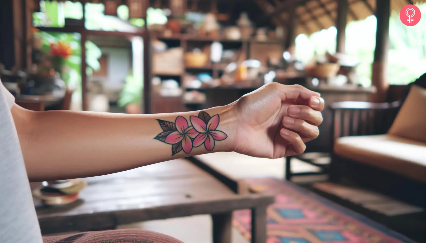 Traditional plumeria tattoo on the wrist