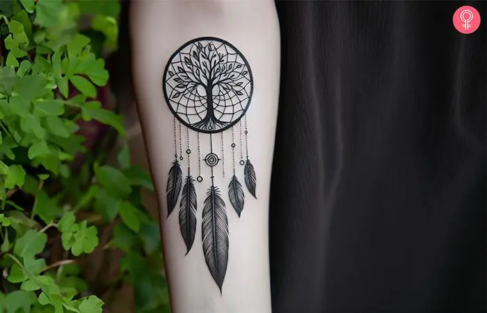 Tree of life dreamcatcher tattoo on the forearm