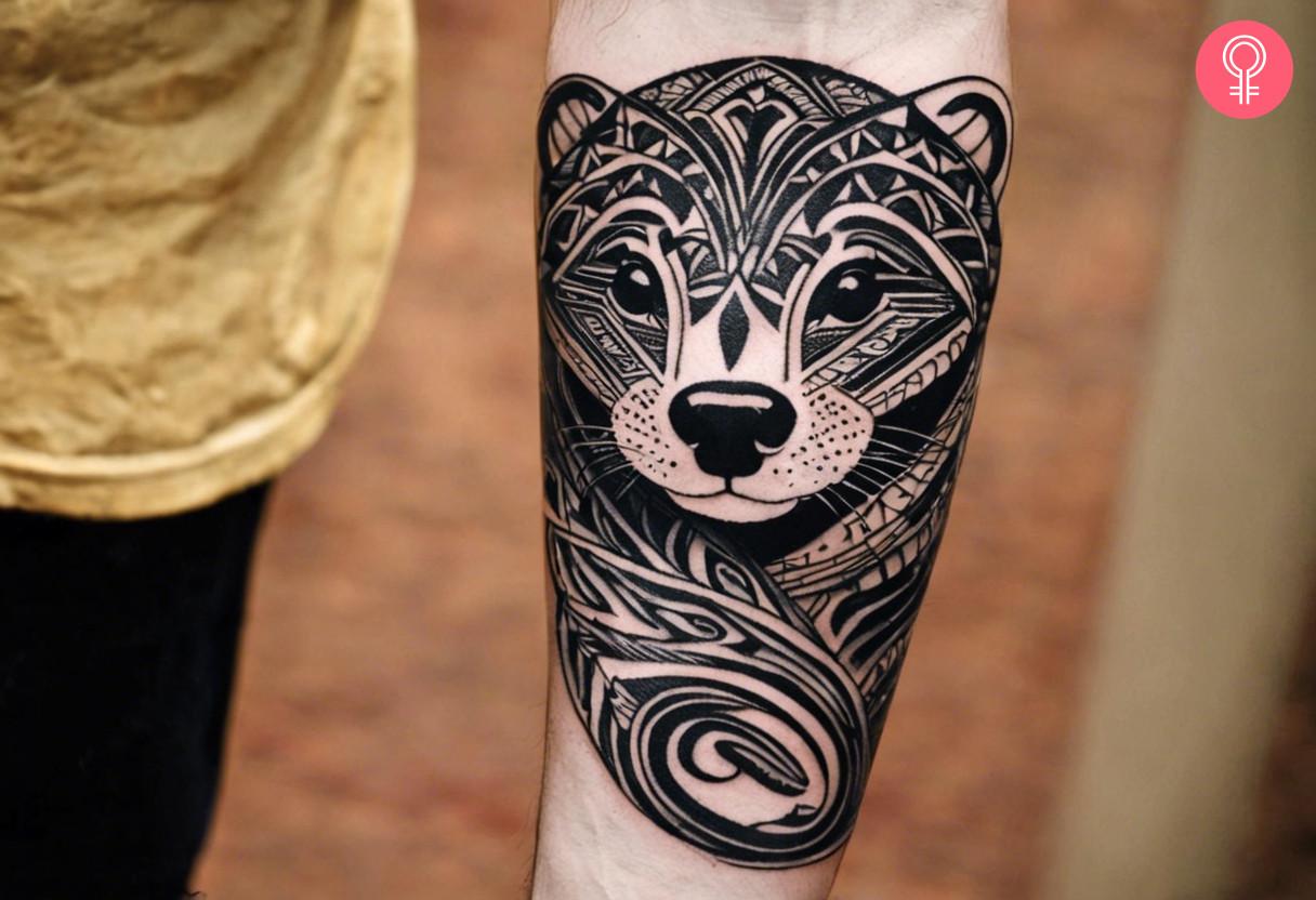 A tribal otter tattoo on the forearm of a man