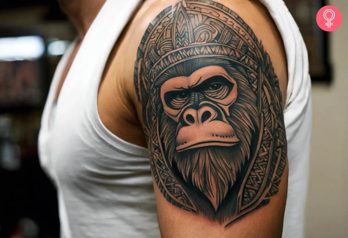 Tribal bigfoot tattoo on the upper arm of a man