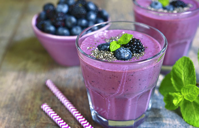 Two glasses of homemade oatmeal, blueberry, and chia seeds protein shake on the table