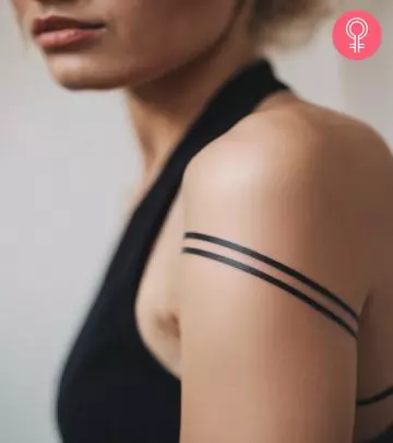 Woman with an unique square tattoo on the upper arm