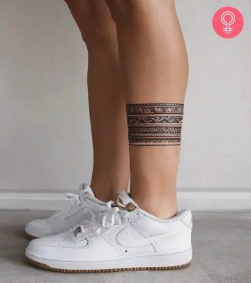 A woman with a Polynesian leg tattoo