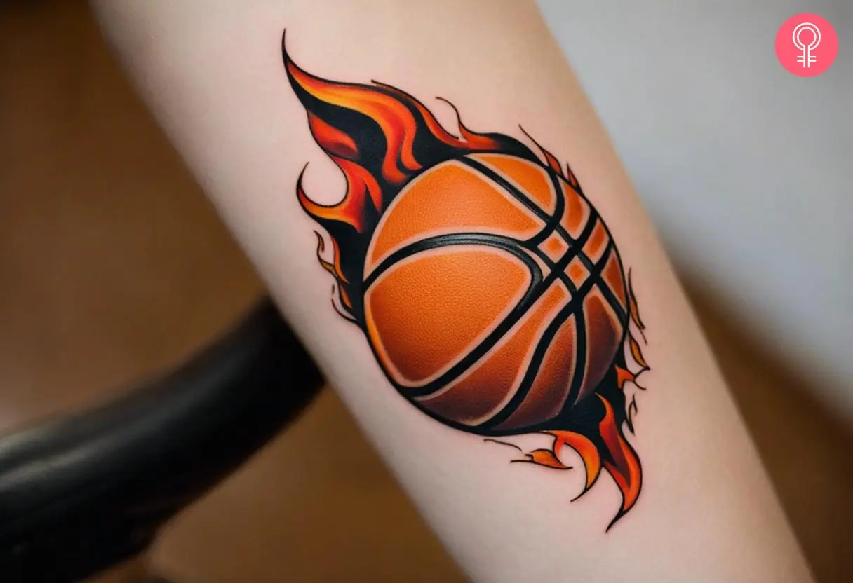 A blazing basketball tattoo on a woman’s forearm