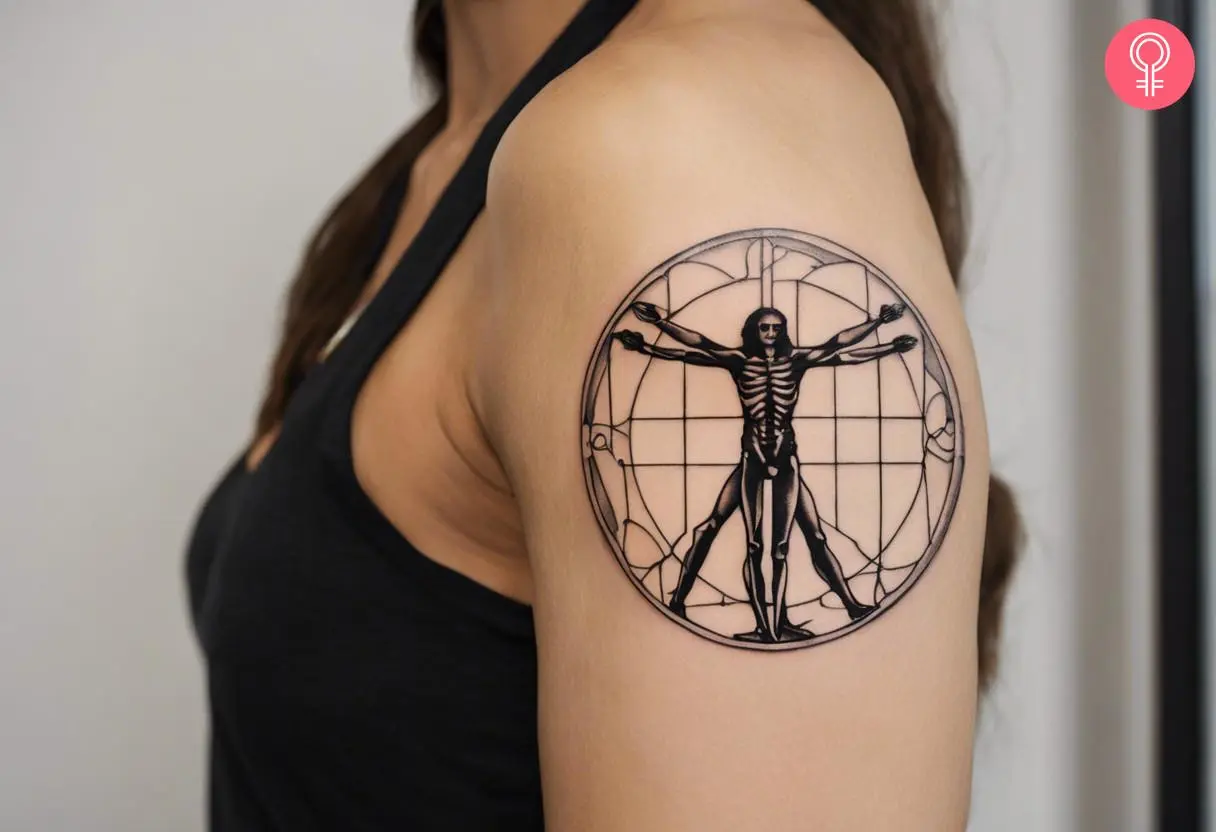 Vitruvian man skeleton tattoo on the outer arm