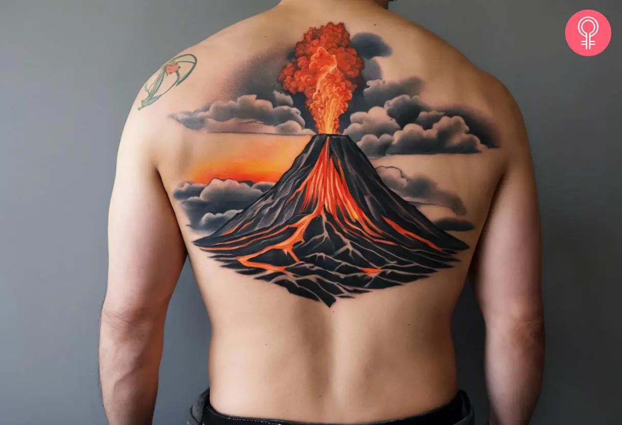 A man wearing a volcano eruption tattoo at the back