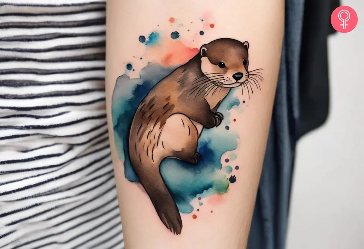 Watercolor otter tattoo on the forearm of a woman