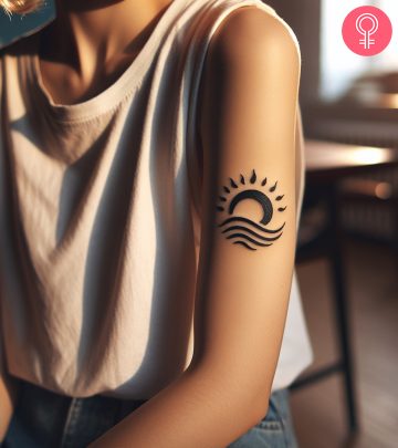 Sunshine tattoo on the arm of a woman