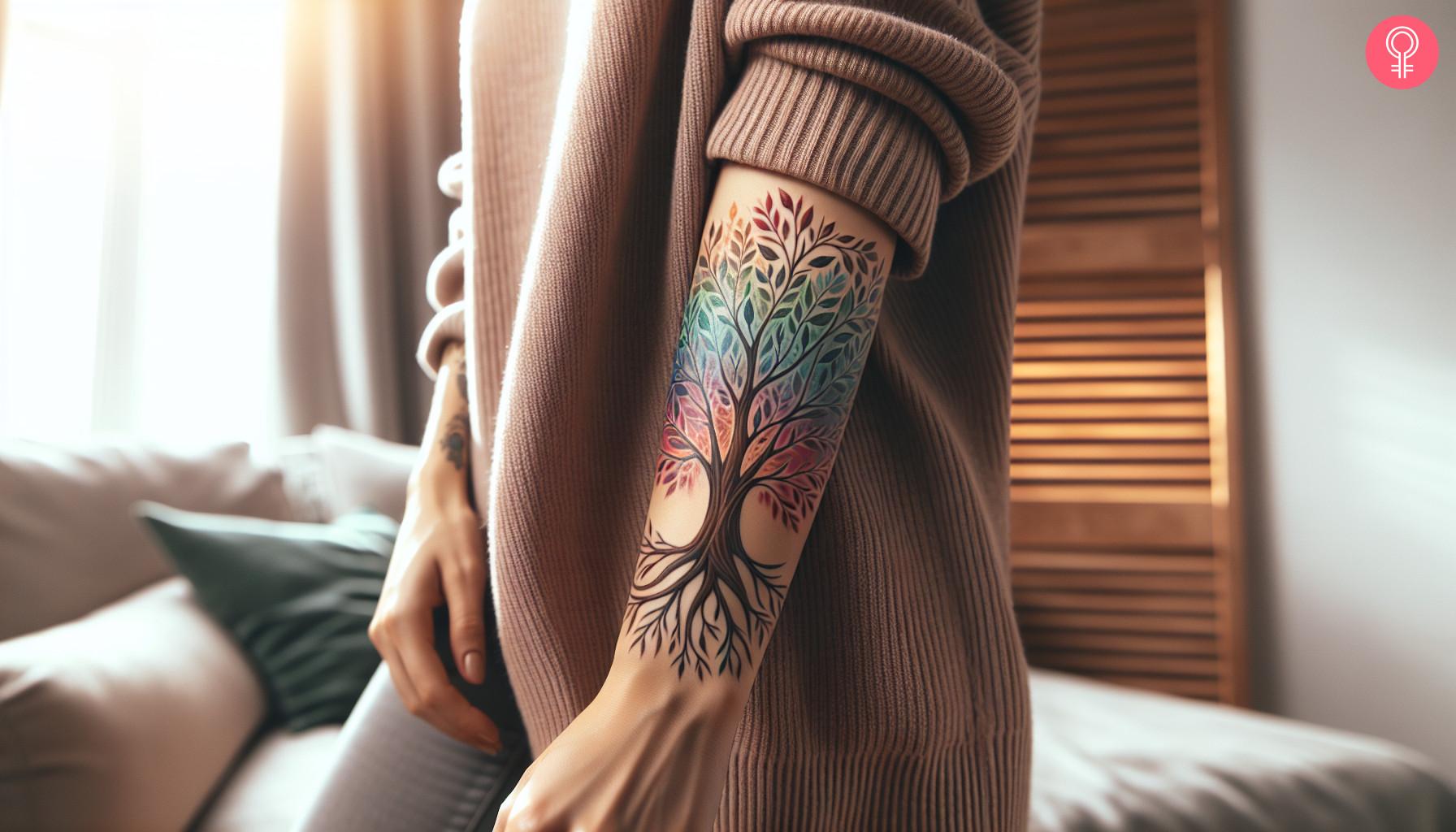 Playful colorful tree tattoo on forearm