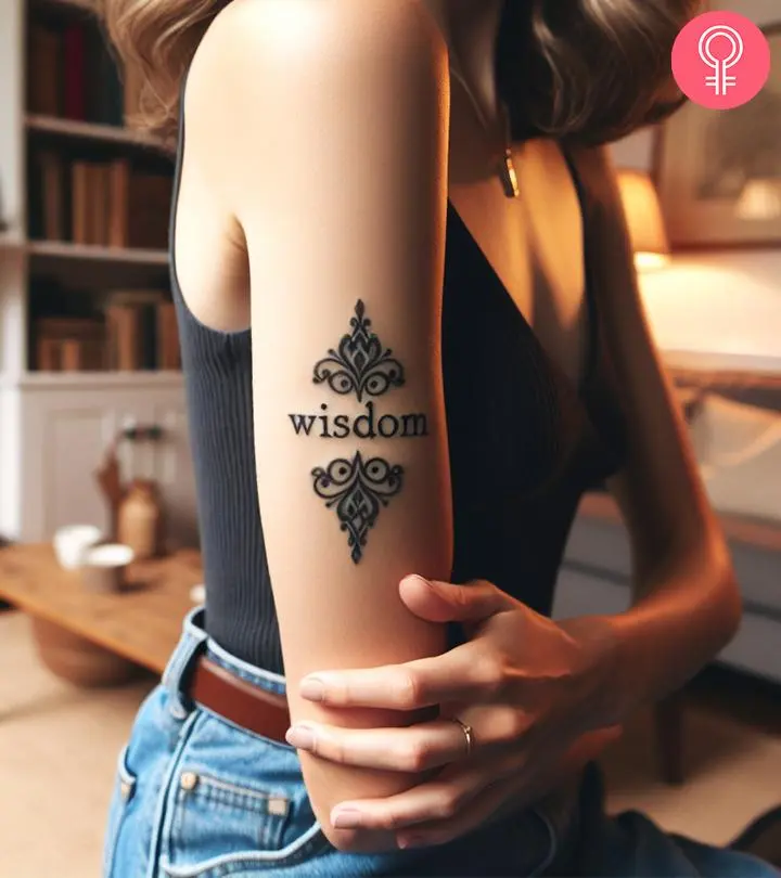 Wisdom tattoo on the upper arm