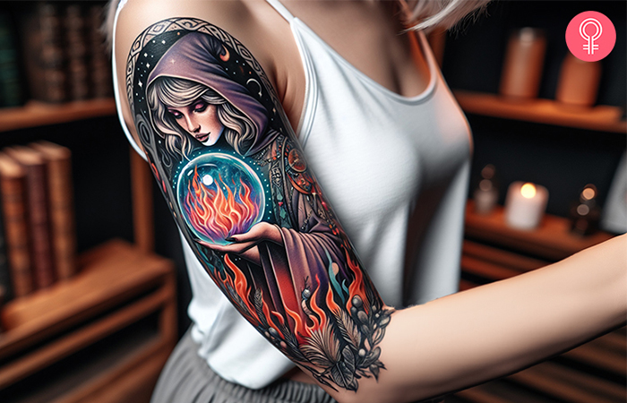 A woman with a wizard and crystal ball tattoo on her arm