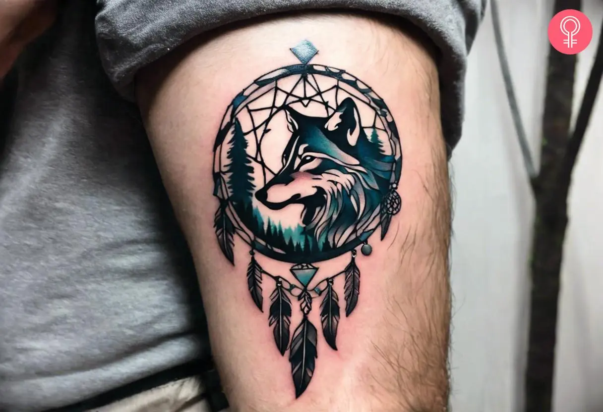 Wolf dreamcatcher tattoo on a man’s upper arm