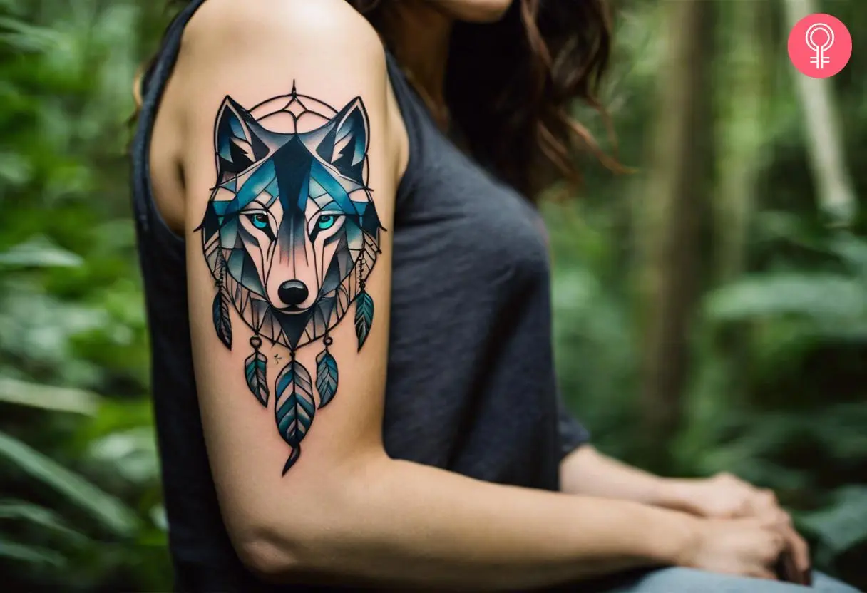 Wolf dreamcatcher tattoo on a woman’s arm