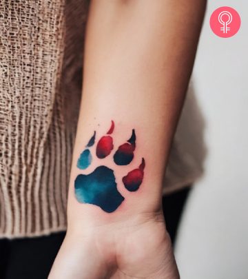 A watercolor polar bear tattoo on the forearm