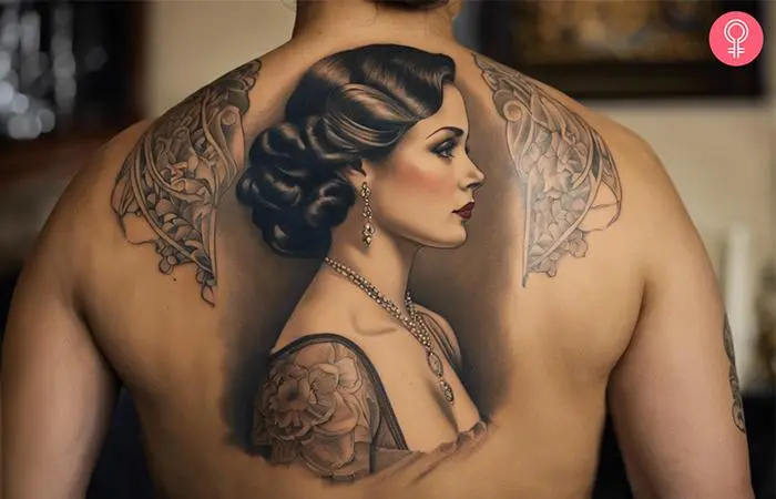 A man wearing a woman portrait tattoo on the back.