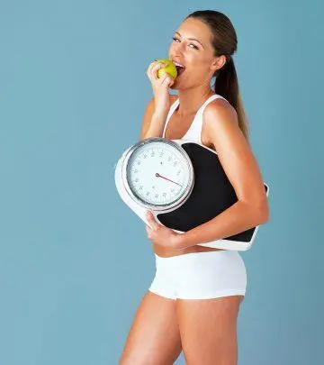 Woman eating an apple for weight loss