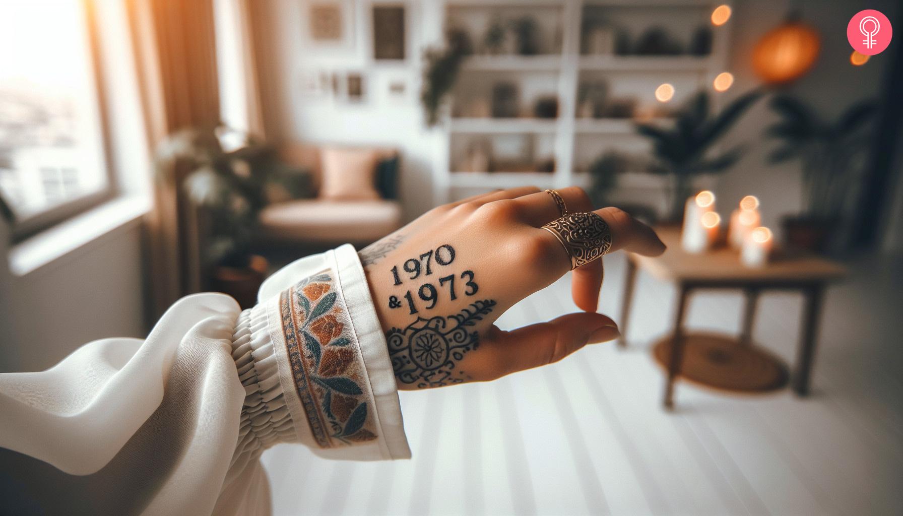 Woman shows her parents' birth year tattoo on the back of her hand