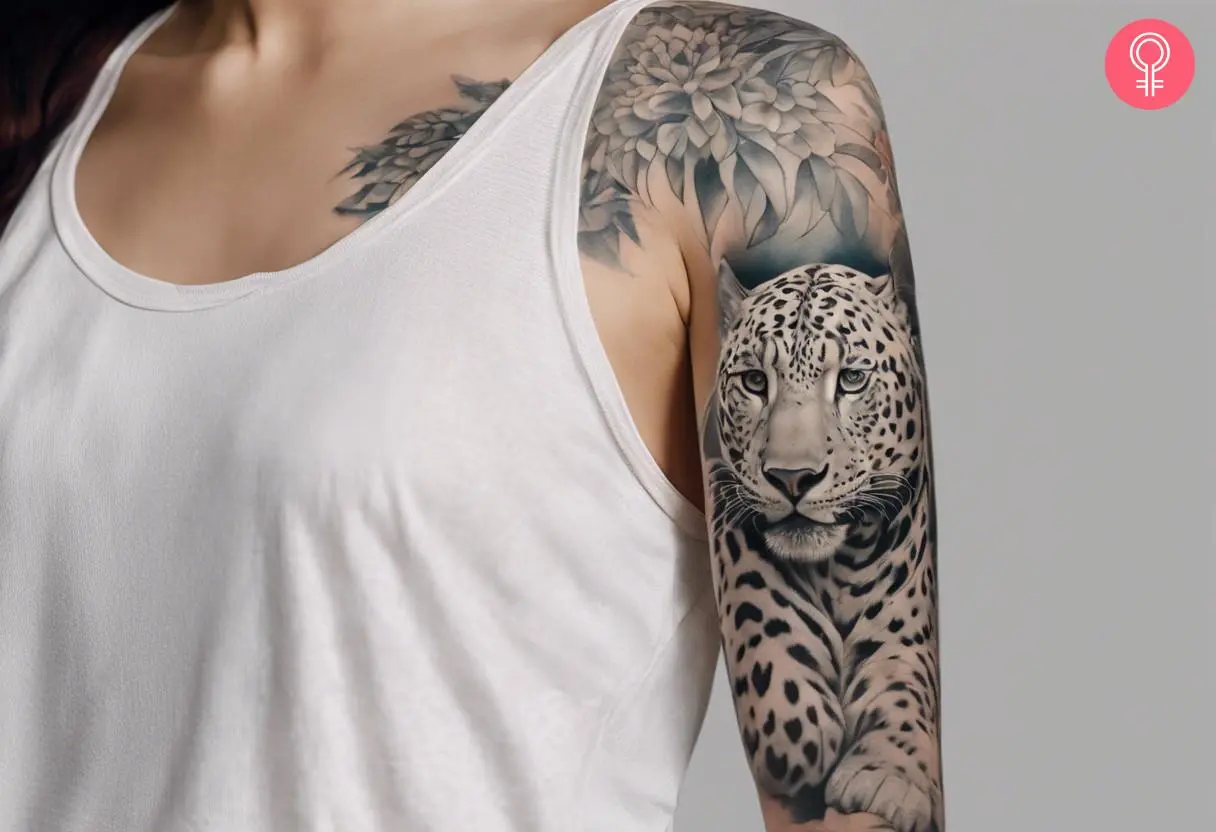 Woman wearing a snow leopard sleeve tattoo