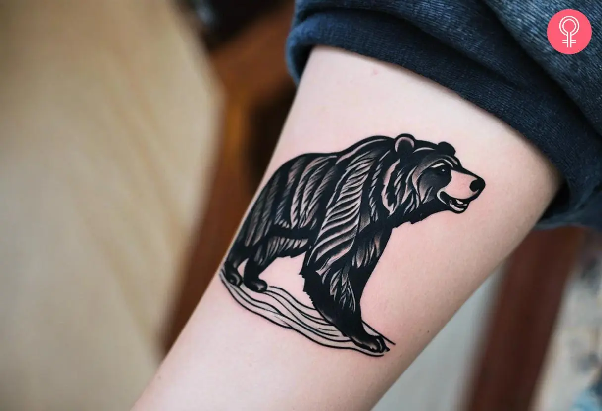 Woman with California bear tattoo on her forearm