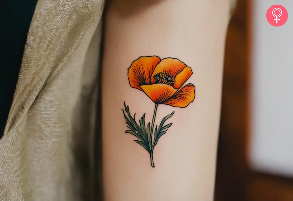 Woman with California poppy tattoo on her arm