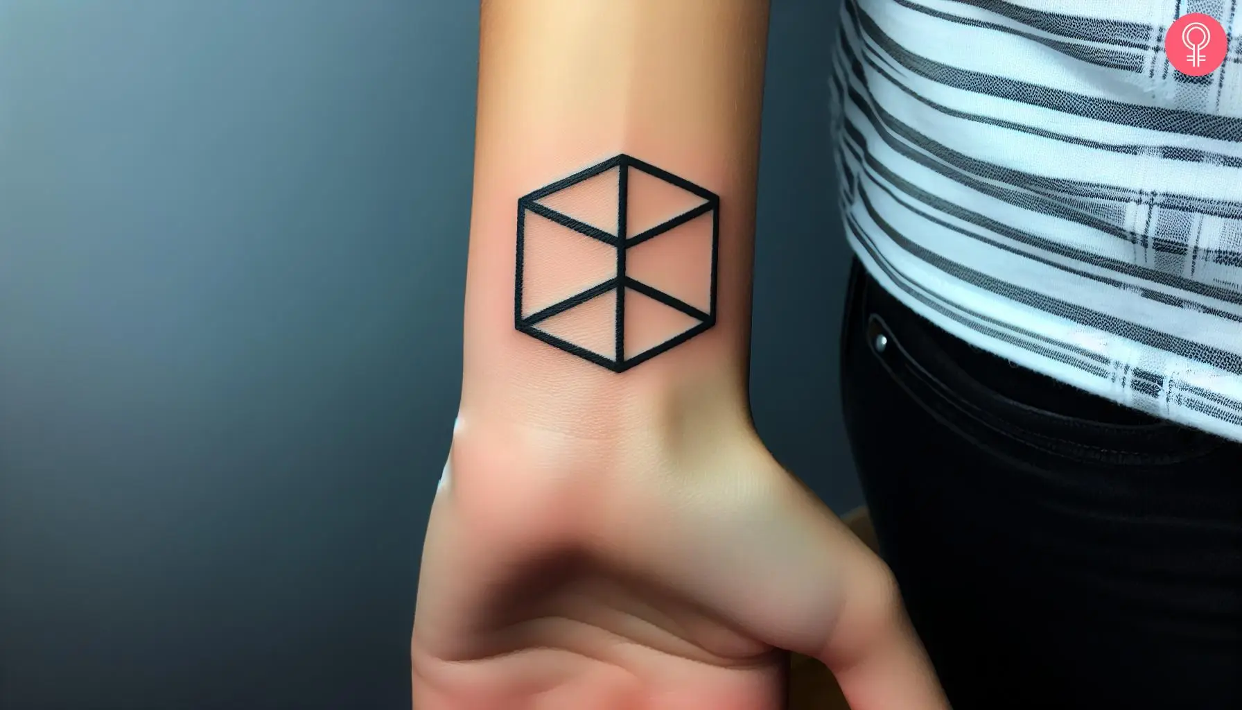 Woman with a 3D square tattoo on the wrist