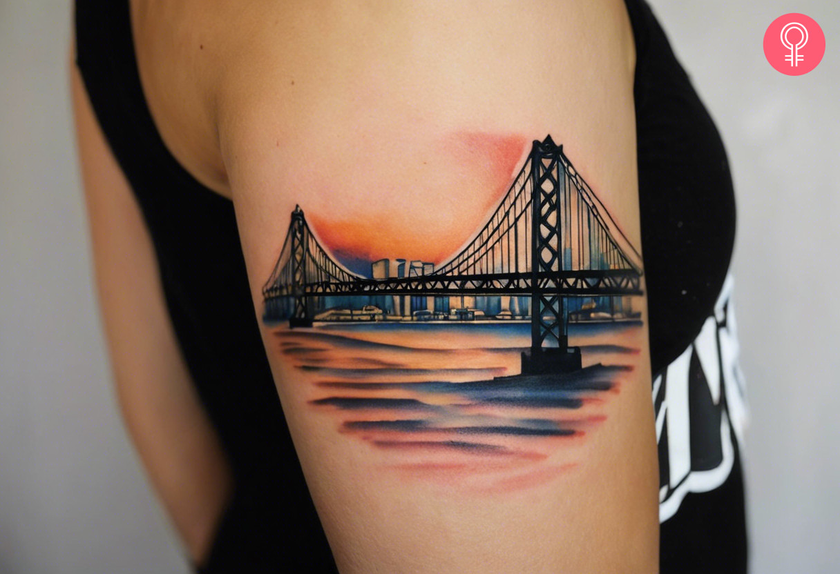 Woman with a Bay bridge tattoo on the arm