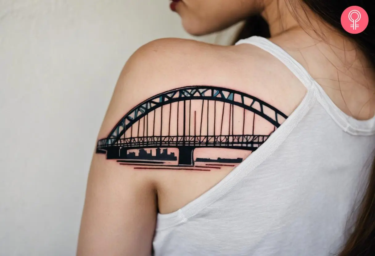 Woman with a Memphis bridge tattoo on the back