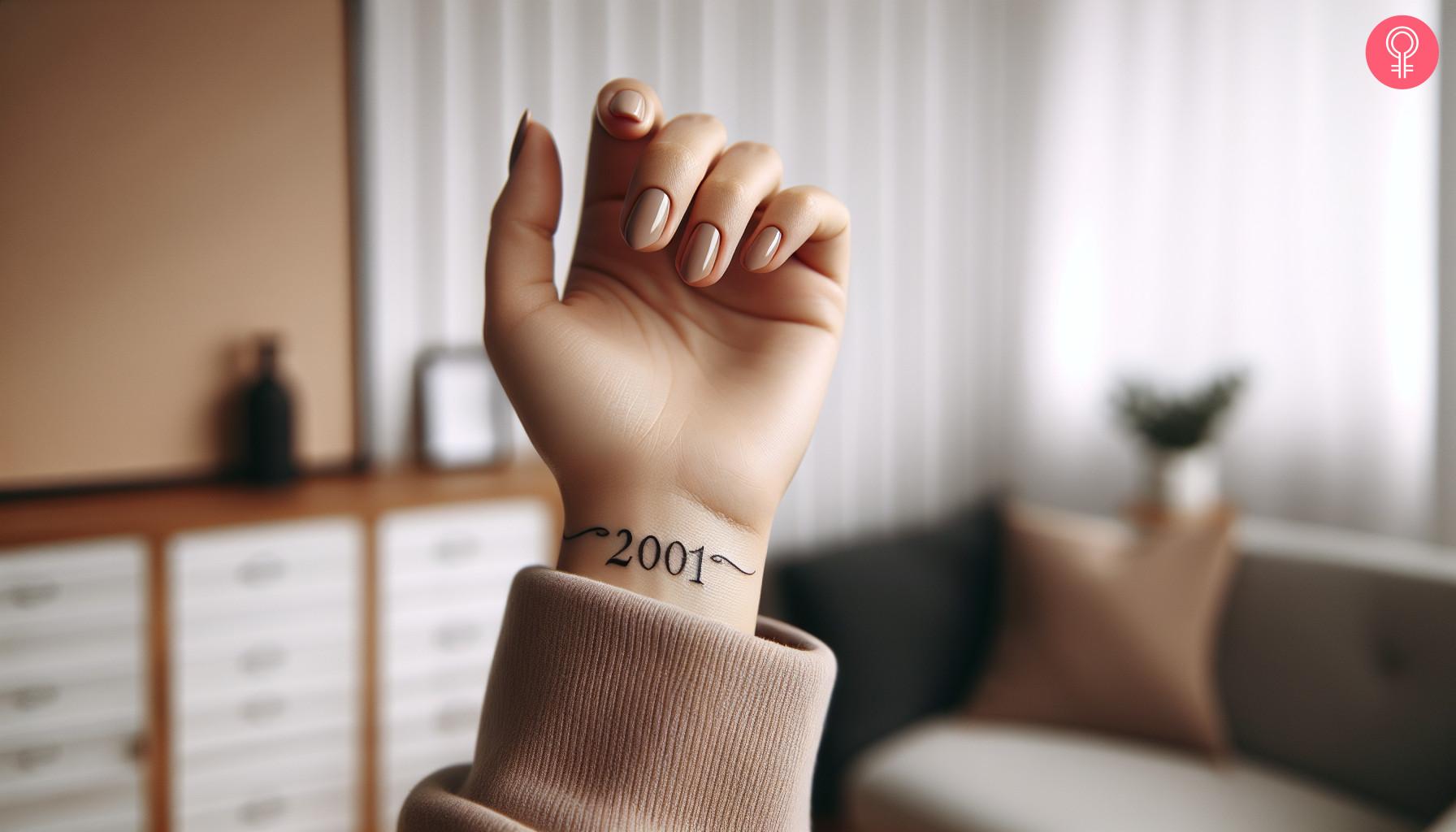 Woman with birth year 2001 tattoo on wrist