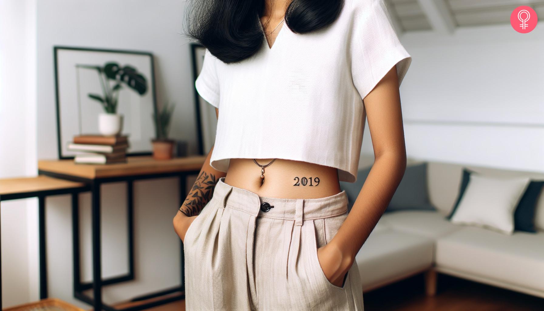 Woman with birth year tattoo on her stomach