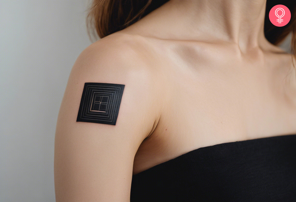 Woman with a black square tattoo on the shoulder