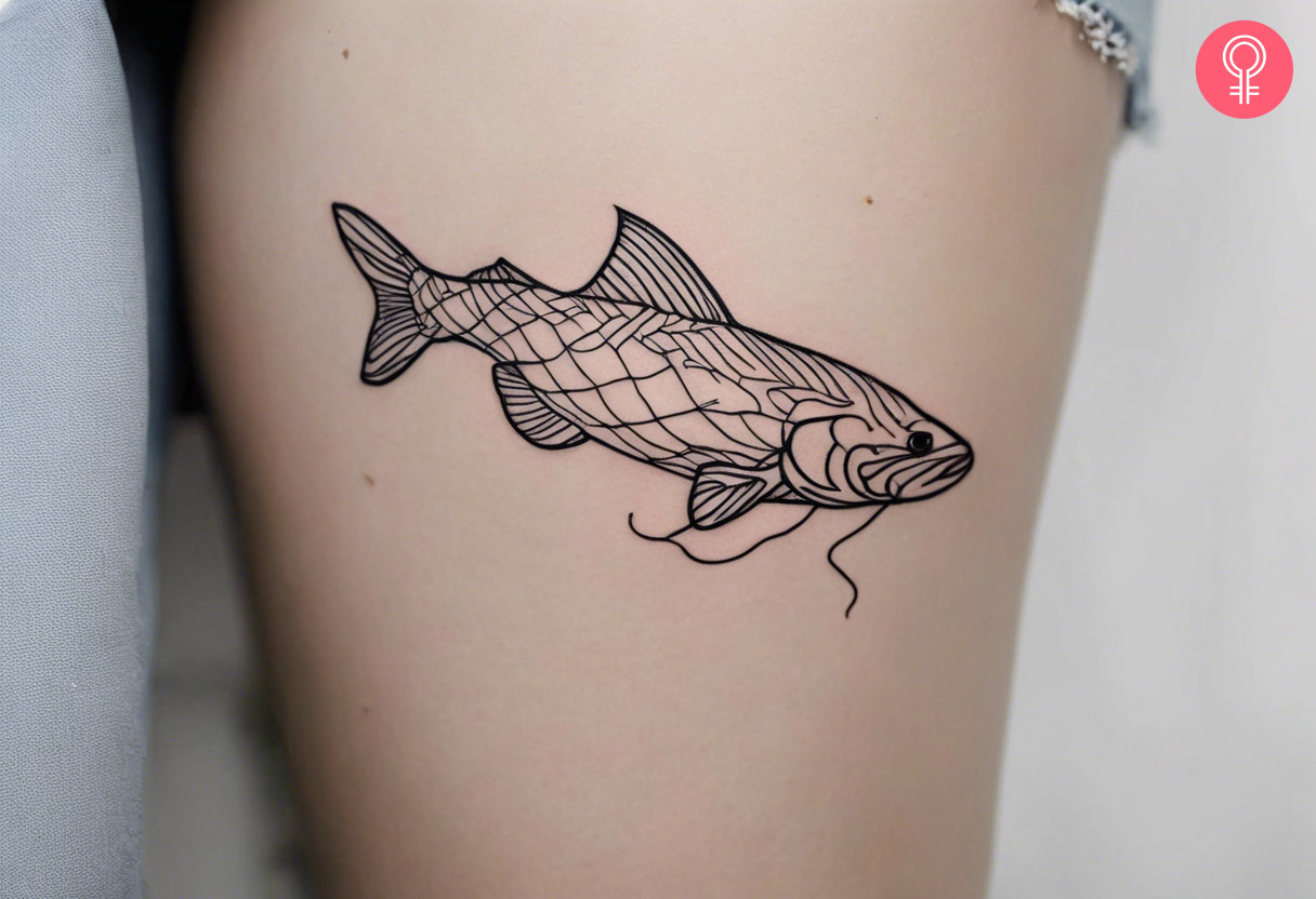 Woman with a catfish outline tattoo on her thigh
