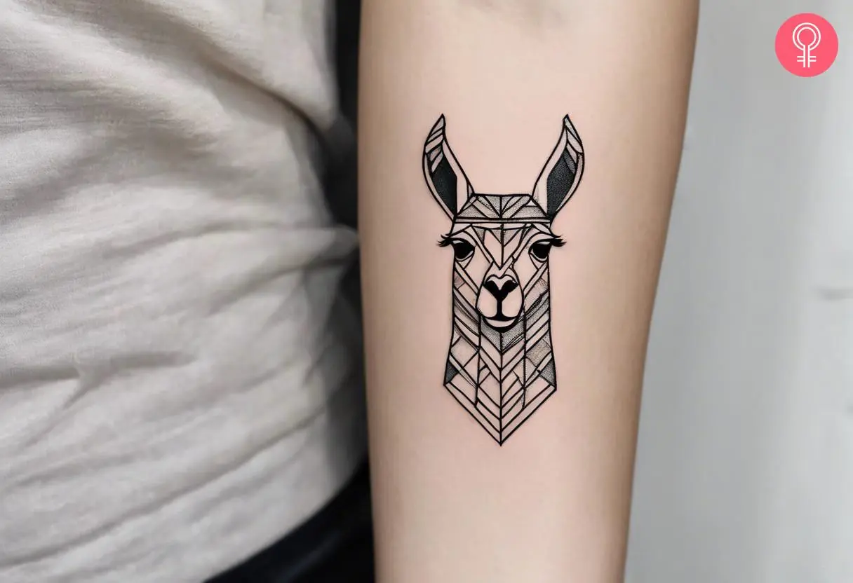 Woman with a geometric llama head inked on the forearm