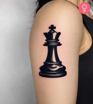 A woman with chess piece tattoo on her shoulder
