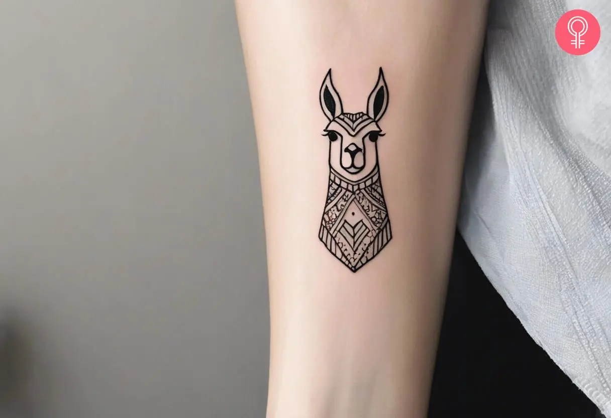 Woman with a minimalist llama tattoo on the forearm