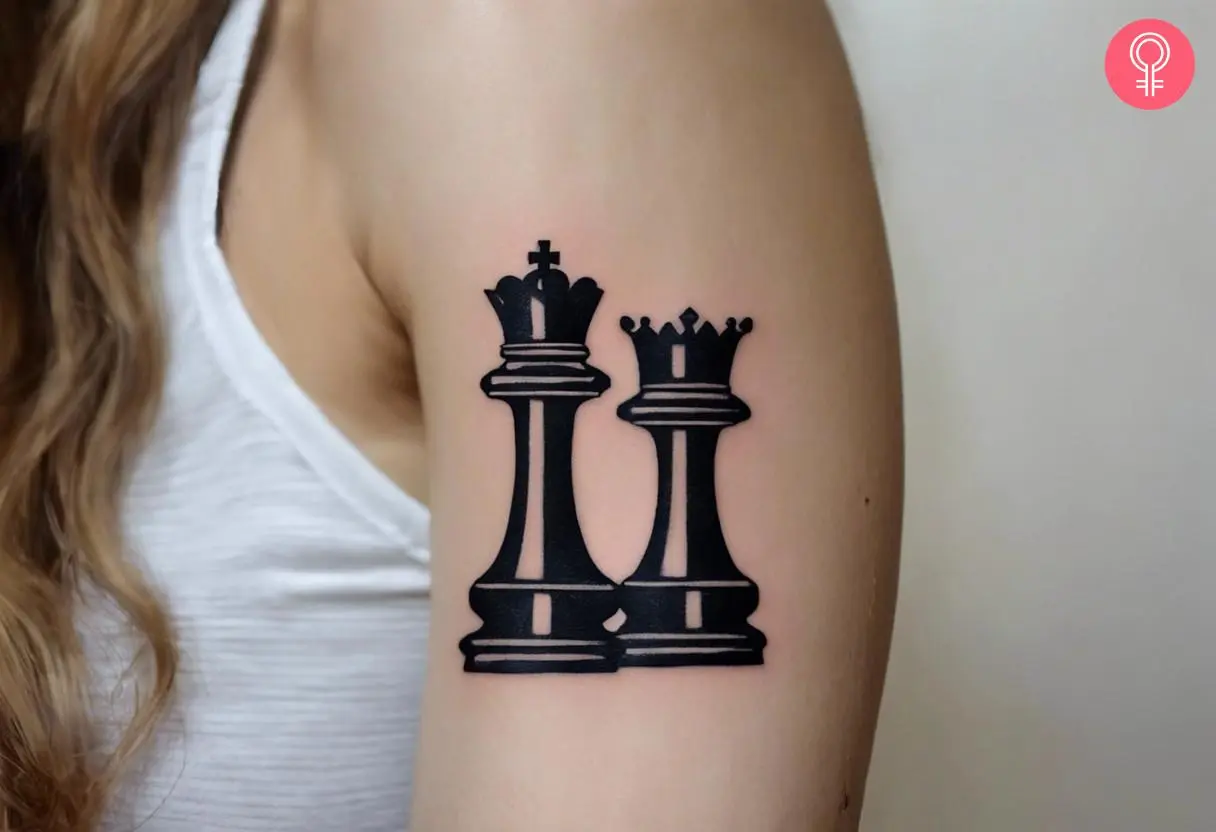 Woman with a relationship king and queen chess piece tattoo