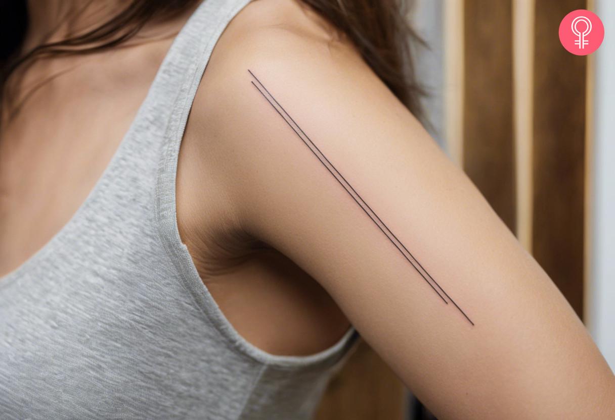 Woman with a straight line arm tattoo