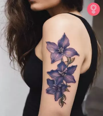 A gladiolus tattoo design on a woman’s forearm