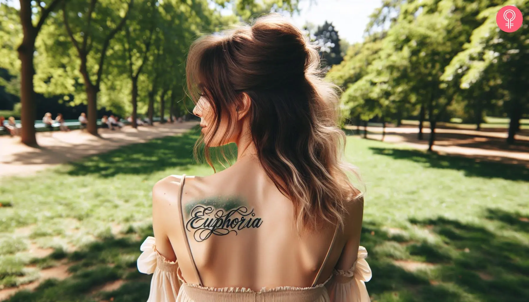 Woman with an ‘Euphoria’ back tattoo